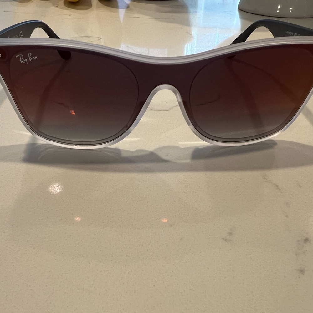 Ray-Ban sunglasses.